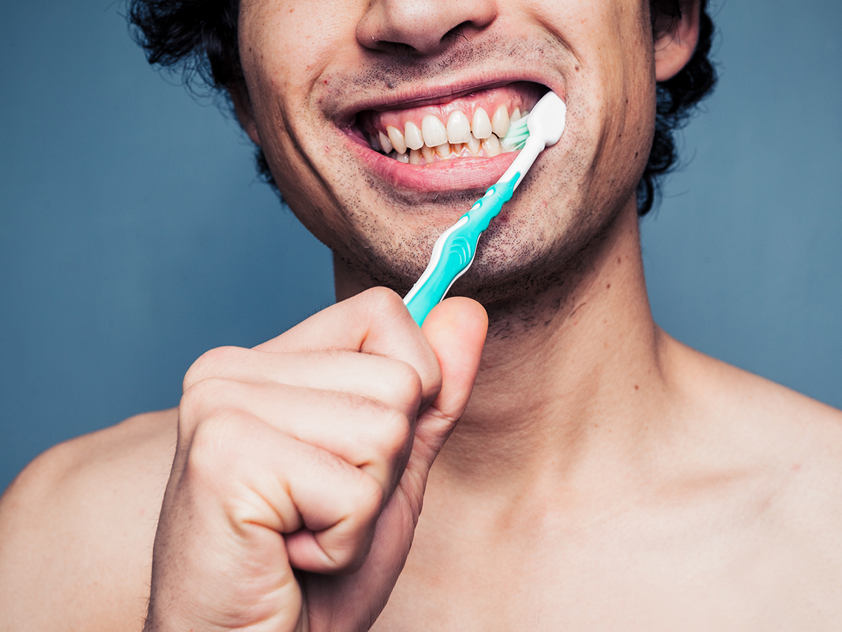 A person brushing their teeth