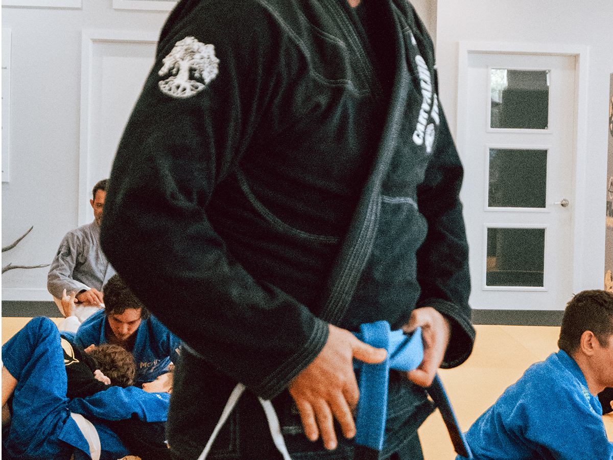 A person wearing a clean BJJ gi