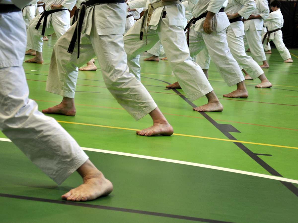 A barefooted person on the mat